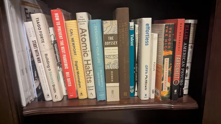 A selection of books from from home, Atomic Habits included.